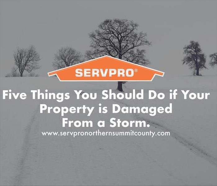 Orange SERVPRO  house logo on image with  snow storm in background 