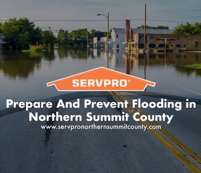 Orange SERVPRO  house logo on image with flooding on road. 