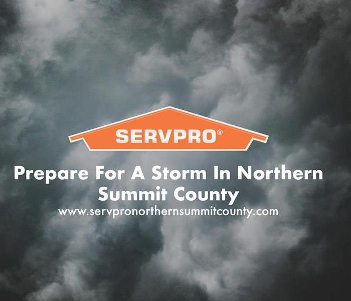 Orange SERVPRO  house logo on dark cloud storm background