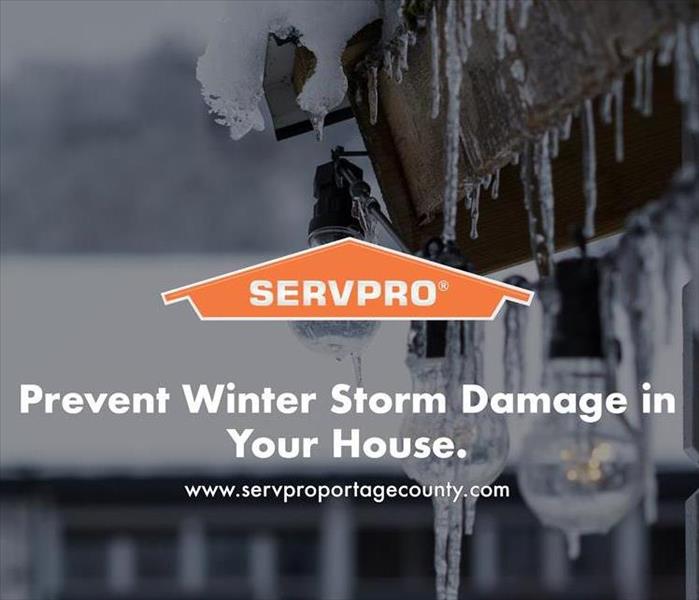 Orange SERVPRO  house logo on image with home that has icicles. 